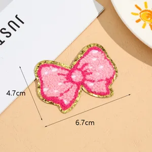 Pink gold-edged bow towel embroidery patch, DIY clothing accessories and badges.
