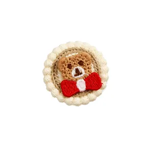 Detailed view of cute round teddy bear embroidery patch, perfect for DIY clothing and bags.