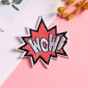 Detailed close-up of a creative comic style WOW explosion embroidered patch for DIY clothing decor.