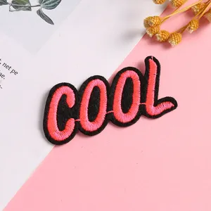 Close up detail view of the creative embroidered cool letter patch, ideal for DIY clothing decoration.