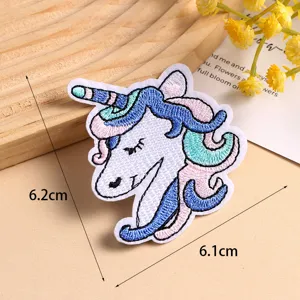 Detailed close-up of a colorful embroidered unicorn patch with fine stitching and dimensions.