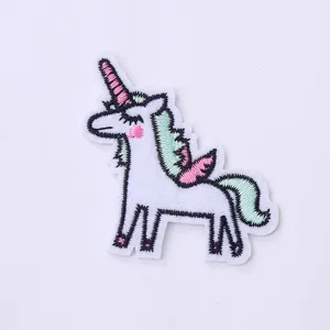 Exquisite embroidered unicorn patch, featuring vibrant pink and green details for DIY crafting.