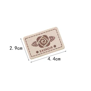 Detailed view of a rectangular fabric embroidery patch with rhinestones, DIY clothing accessory.