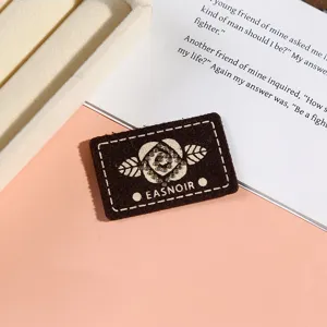 Detailed shot of rhinestone rose embroidery cloth patch for DIY clothing accessories and bags.