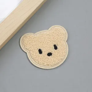 Cute fluffy bear plush patch for DIY clothing, jackets, and hats decoration. Soft texture accessory.