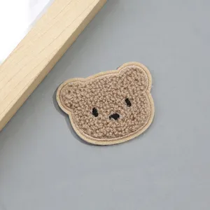 Cute brown teddy bear plush embroidery patch for DIY clothing and hat decoration accessories.
