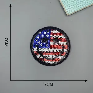 Detailed view of the American flag smiley face sequin patch, perfect for DIY clothing repair.