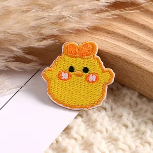 Detailed shot of cute yellow chick cartoon embroidery patch clothing accessory DIY badge decor