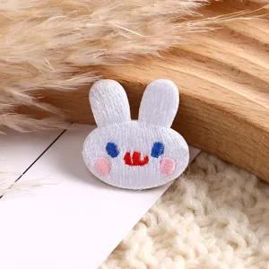 Detailed close-up view of cute cartoon animal embroidery patch, fine stitching, perfect DIY decor.