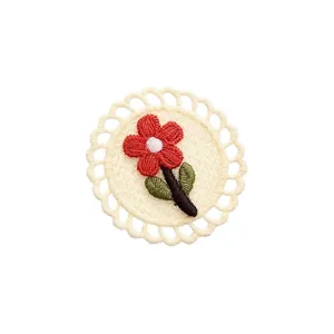 Round embroidered flower patch with beige lace edge, red floral motif for apparel decoration.