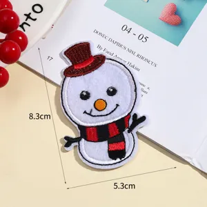Christmas snowman embroidered patch detail view, red hat scarf DIY clothing accessory.