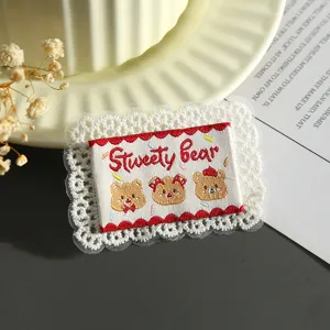 Cute bear embroidered lace patch, decorative DIY clothing accessory badge with sweet design.