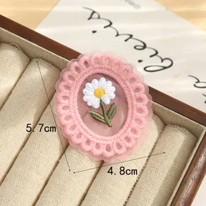 Vintage lace embroidered patch featuring a cute daisy design, ideal for DIY crafts and apparel.