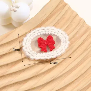 Carino toppa in tessuto pizzo fiocco ricamato adesivo accessorio vestiti DIY 4x5cm