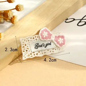 Sweet lace border patch with pink bow embroidery, perfect DIY clothing decoration accessory.