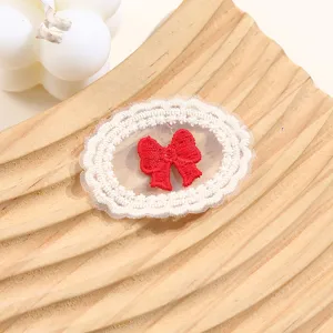 Grazioso patch in tessuto ricamato in pizzo con fiocco rosso per accessori di abbigliamento
