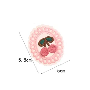 Pink lace cherry embroidery patch detail showing exquisite stitching and cute fruit design.