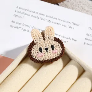 Cute knitted bunny embroidery patch detail view, soft texture for clothing decoration accessories.
