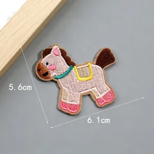 Detailed shot of a cute cartoon pony embroidered cloth patch, DIY apparel accessory decoration.