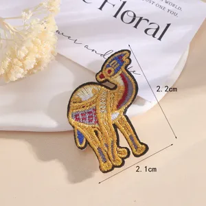 Exquisite embroidered animal patch with gold thread details, perfect for DIY clothing decoration.