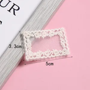 Detailed view of the sweet white lace embroidery patch, ideal for DIY crafts and hat decoration.