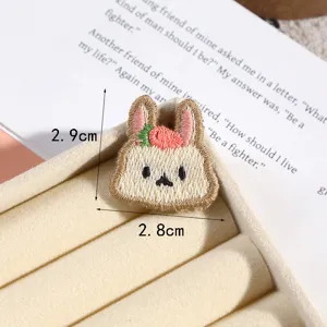 Cute cartoon rabbit embroidery patch, delicate strawberry detail, perfect DIY accessory.