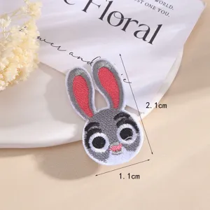 Cute cartoon animal embroidery patch, lovely rabbit clothing accessory, detailed close-up view.