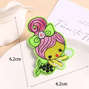 Close-up of cute cartoon mermaid embroidery patch with fine stitching and vivid colors.