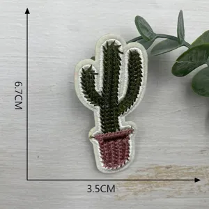 Detailed close-up of the green cactus embroidered patch, showing fine stitching quality.