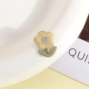 Handcrafted embroidered flower patch, cute knitted daisy design for DIY apparel and accessories.