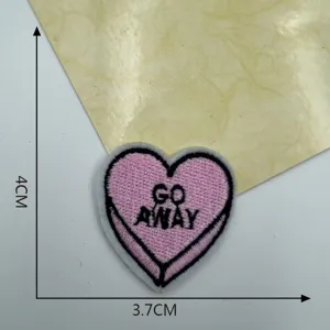 Detailed view of the pink heart embroidered patch featuring GO AWAY text, sized 3.7x4cm for DIY.