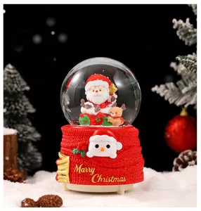 Christmas snow globe resin ornament desktop decoration with cute santa and snowman design.