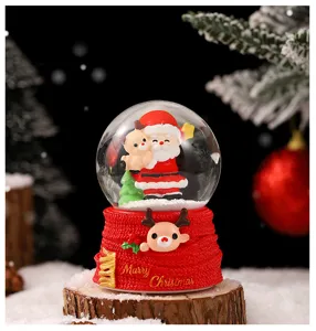 Christmas snow globe desktop ornament with glowing light and cute resin Santa Claus figurine.