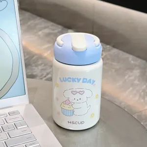Detailed view of the cute portable insulated water bottle with cartoon dog design and blue lid.