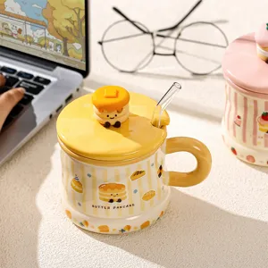 Cute ceramic coffee mug with adorable pancake lid and glass straw, yellow striped design.