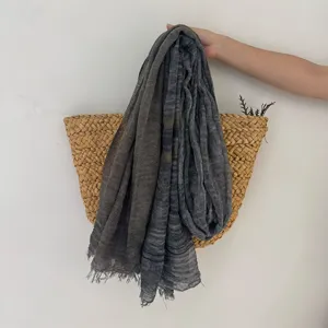 Detailed view of lightweight breathable striped scarf, vintage literary style accessory.