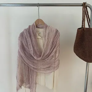 Detailed view of the elegant gold-thread crinkled solid color scarf shawl, chic texture.
