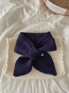 Dark blue knit short scarf detail, soft jacquard texture with cute heart charm for winter.