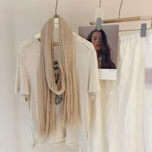 Solid color pleated thin scarf detail view, minimalist vintage style accessory for women.