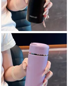 Detail shot of mini portable thermos cup, compact pocket size design with metallic rim accents.