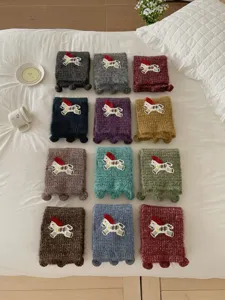 Charming knit pony scarf featuring cute embroidered horse patch and playful tassel accents for women.