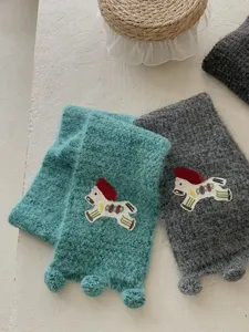 Chic knit pony scarf for women, cozy winter neck warmer with cute embroidered design.