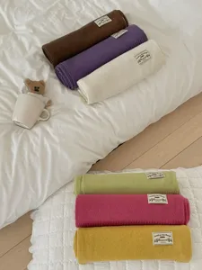 Cozy solid color knitted woolen scarf roll detail shot for women winter warm accessory