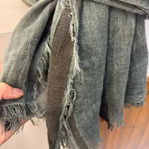Close-up detail of the retro striped cotton linen blend scarf showing unique frayed edge texture.