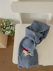 Cute knitted pony scarf for women, cozy winter neck warmer with lovely embroidered horse design.