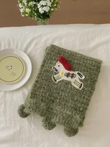 Green fuzzy knitted scarf with cute embroidered pony patch, cozy winter neck warmer accessory.