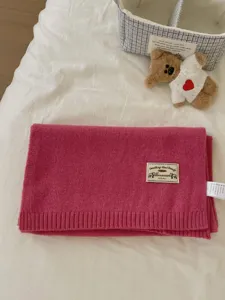 Pink knitted scarf solid color winter warm woolen scarf with vintage badge and wash label.