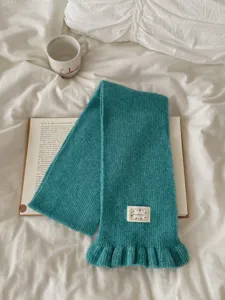 Teal knitted scarf for women with ruffles, ideal for autumn winter warmth and stylish daily look.