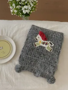 Charming knitted gray scarf featuring a cute embroidered pony patch, cozy and warm for winter.