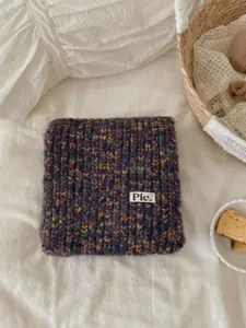 Cozy retro speckled knit winter scarf for women, warm and stylish woolen neck wrap.